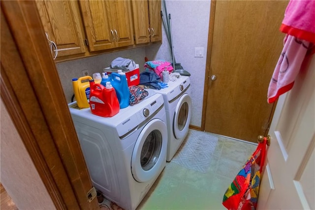 washroom with cabinets and independent washer and dryer