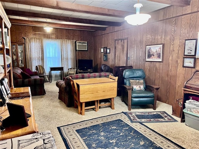 living room with a wall mounted air conditioner, carpet, wood walls, and beam ceiling