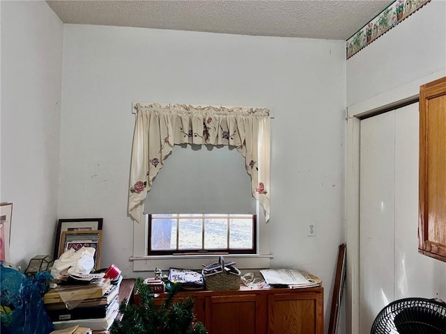 office area with a textured ceiling