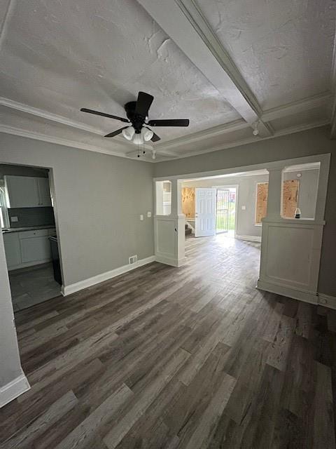 3920 S Benton Ave, Kansas City, MO 64130 - unfurnished living room featuring dark wood finished floors, baseboards, a ceiling fan, and ornamental molding