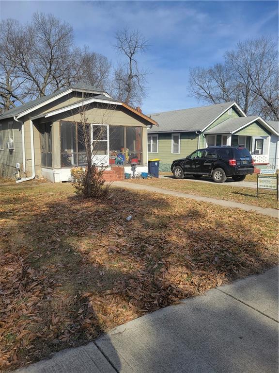 view of property exterior featuring a sunroom