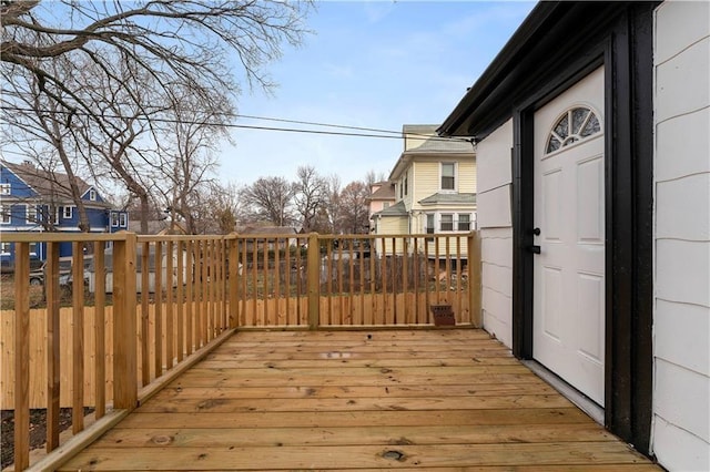 wooden terrace with a residential view