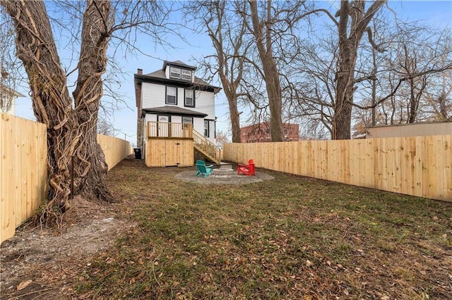 view of yard with a fenced backyard and a playground