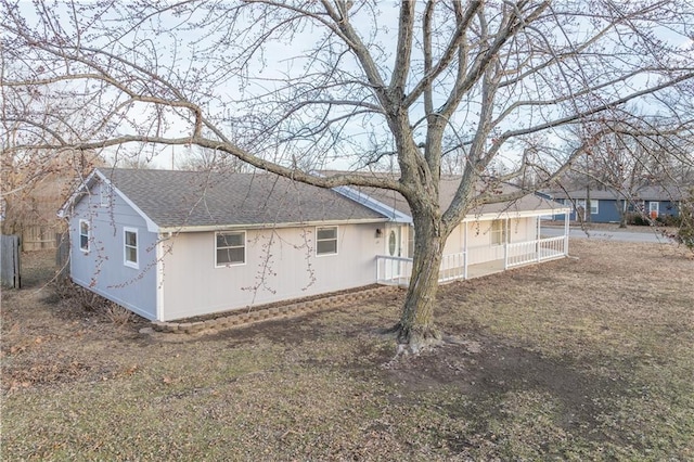 view of property exterior featuring a lawn