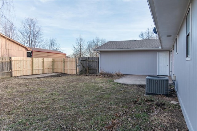 view of yard with a patio and central air condition unit