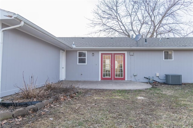 back of house featuring a patio, central AC, and french doors