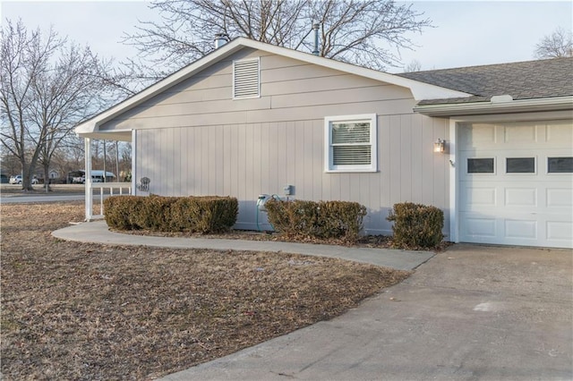 view of property exterior with a garage