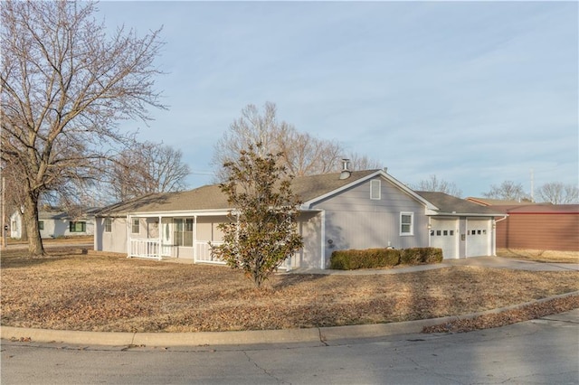 single story home featuring a garage and covered porch