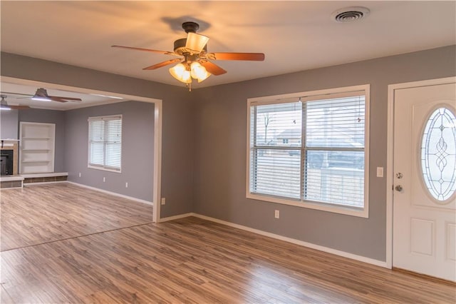 foyer entrance featuring hardwood / wood-style floors and ceiling fan