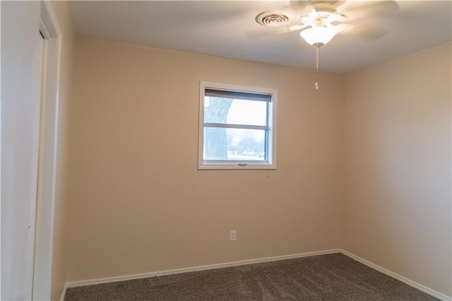 spare room with carpet floors and ceiling fan