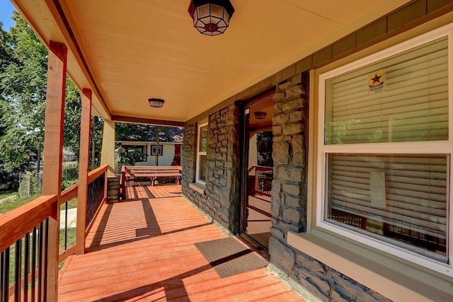 wooden terrace with a porch