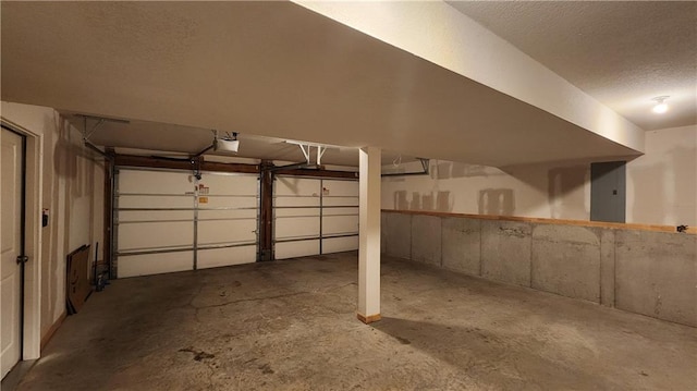 garage featuring a garage door opener and electric panel