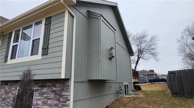 view of property exterior with a yard