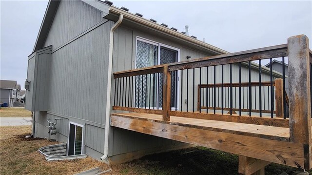 view of home's exterior with a wooden deck