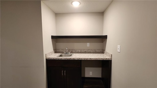 bathroom featuring vanity and a textured ceiling