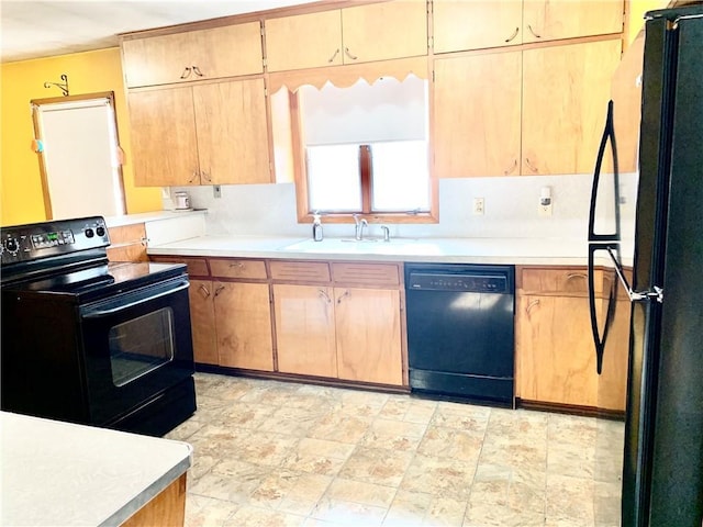 kitchen featuring black appliances and sink