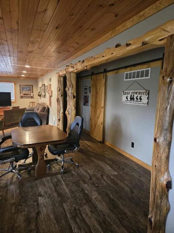 office space featuring wood-type flooring, a barn door, and wood ceiling