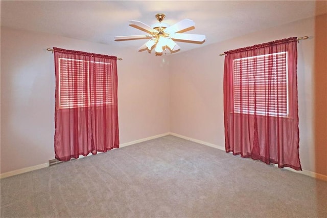 carpeted empty room with ceiling fan