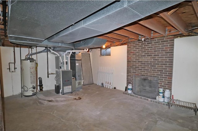 unfinished basement with heating unit, gas water heater, and a fireplace