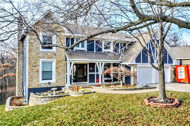 view of front of house featuring a garage and a front lawn