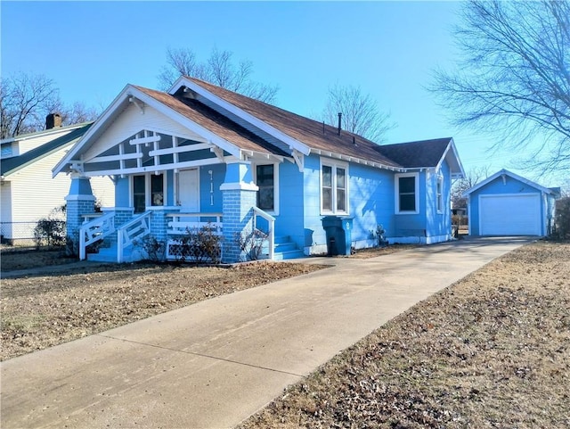 view of front of house with an outbuilding, a porch, and a garage