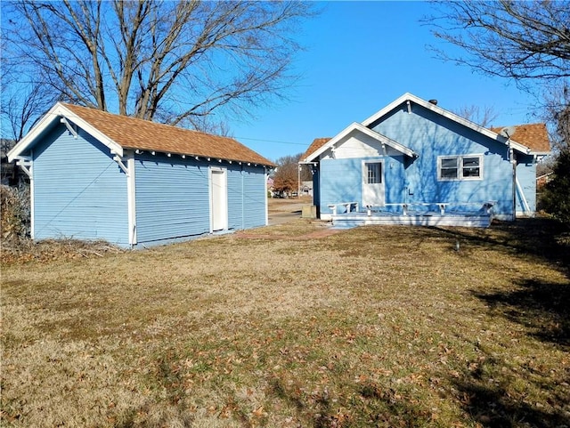 rear view of property with a lawn