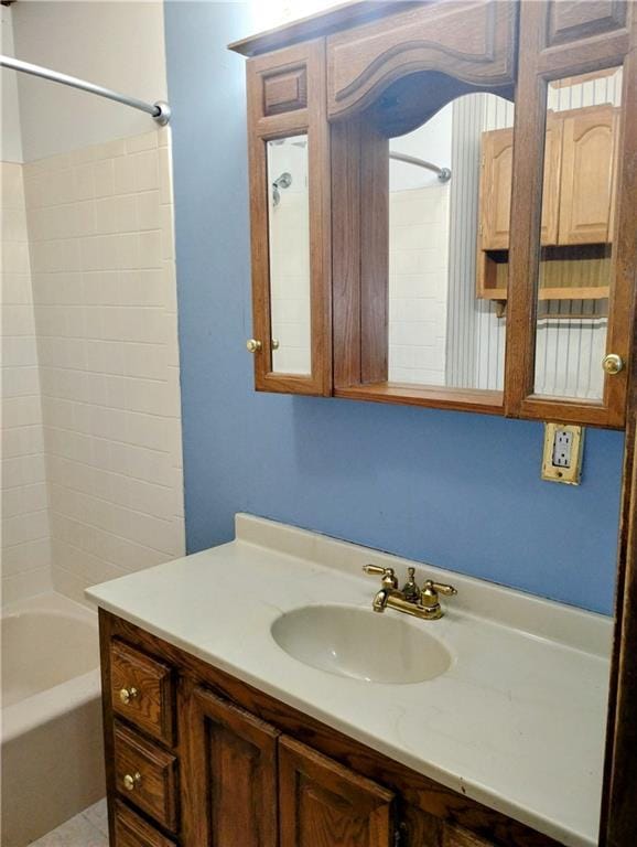 bathroom with tub / shower combination and vanity