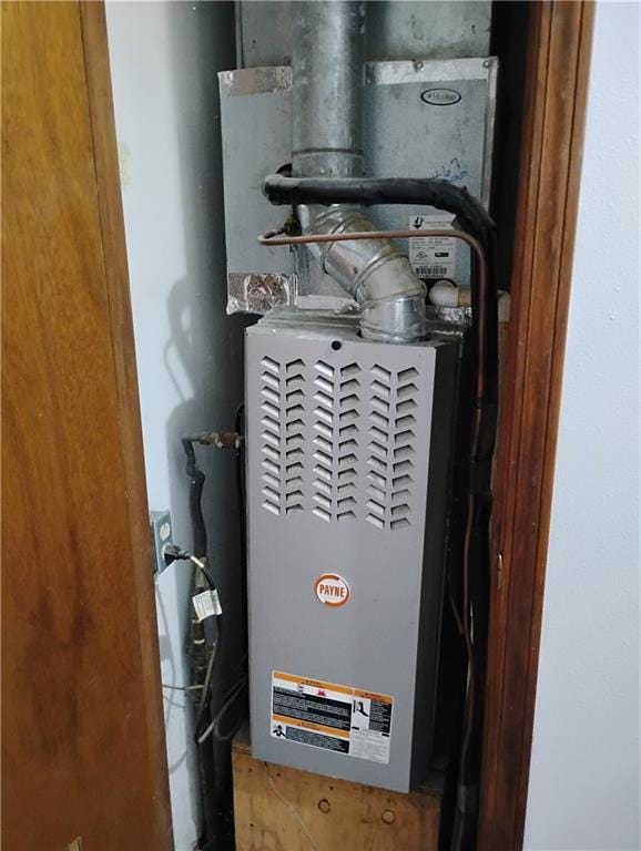 utility room with heating unit