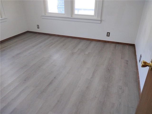 empty room with light wood-type flooring