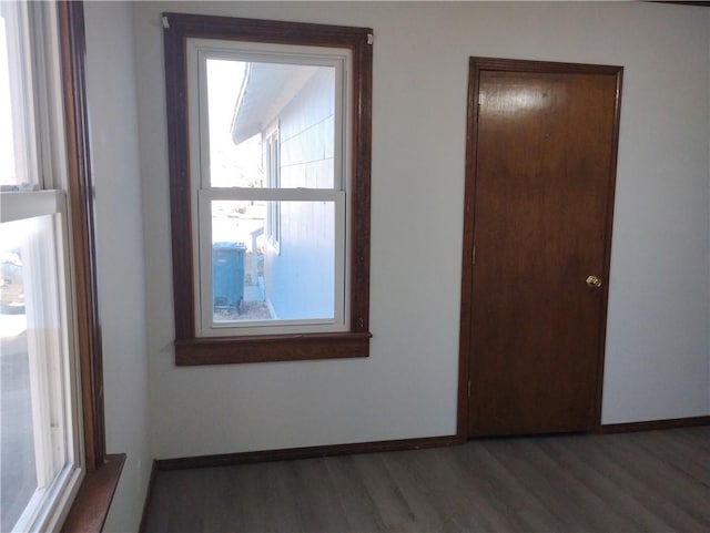 spare room with dark wood-type flooring