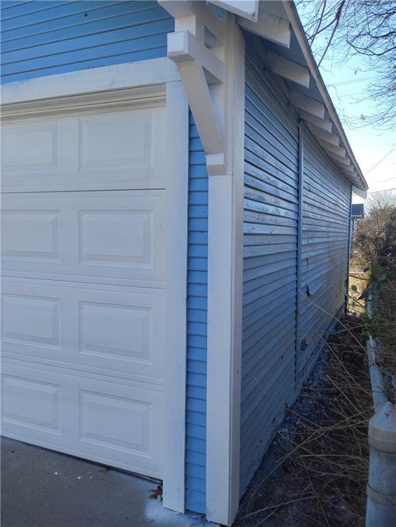 view of side of property with a garage