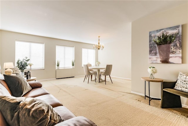 living room featuring a notable chandelier and light colored carpet