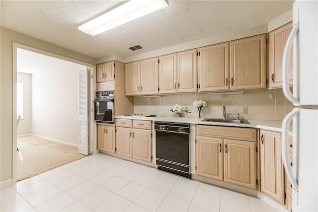 kitchen with light carpet, sink, black appliances, and light brown cabinets