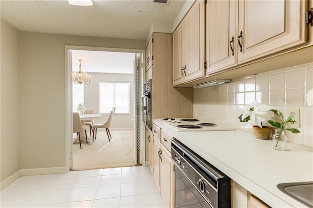 kitchen with pendant lighting, white electric stovetop, black dishwasher, stainless steel oven, and light brown cabinets