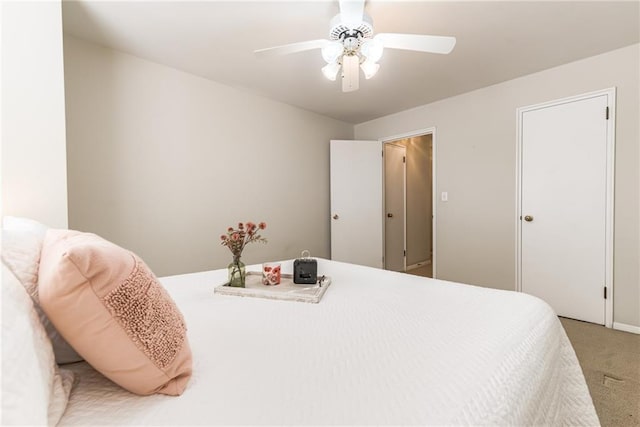 carpeted bedroom featuring ceiling fan