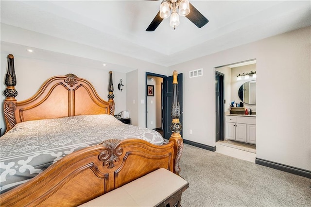 carpeted bedroom featuring connected bathroom and ceiling fan