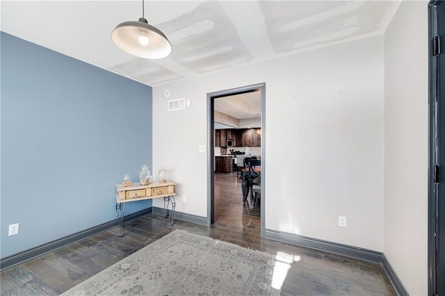 unfurnished room featuring dark hardwood / wood-style flooring