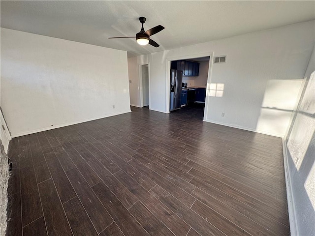 unfurnished living room with ceiling fan and dark hardwood / wood-style floors