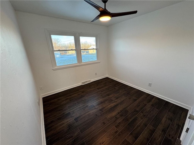 unfurnished room featuring ceiling fan and dark hardwood / wood-style floors