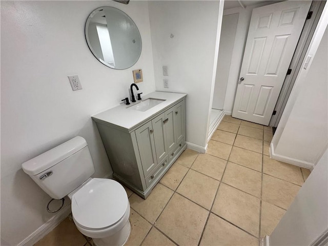 bathroom featuring vanity, toilet, and tile patterned floors