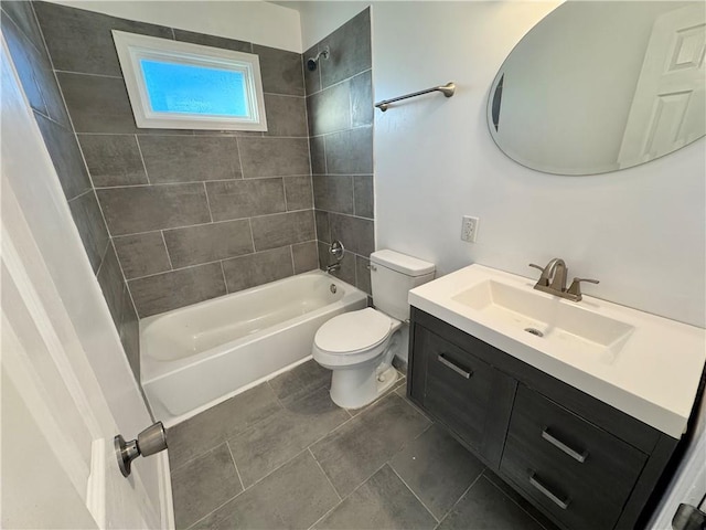 full bathroom featuring vanity, toilet, and tiled shower / bath