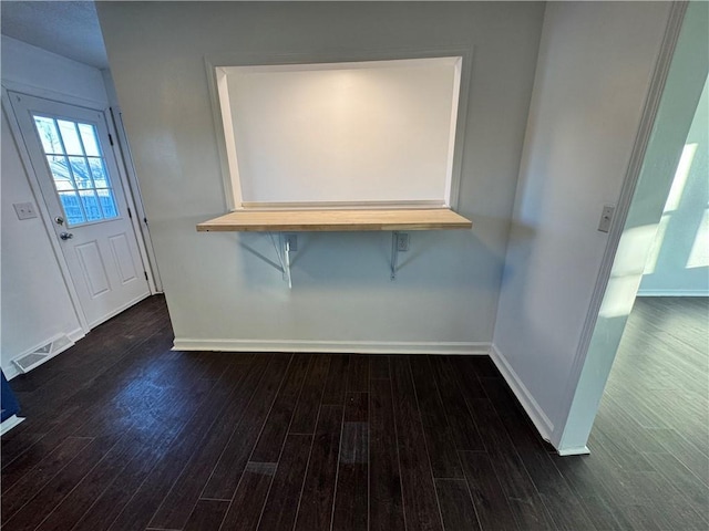 interior space featuring dark wood-type flooring