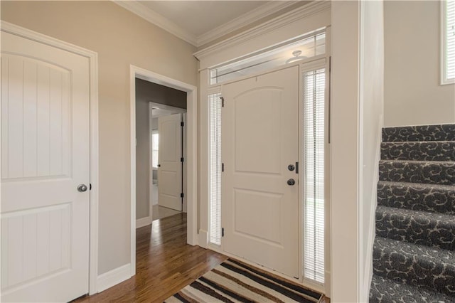 foyer featuring dark hardwood / wood-style flooring and crown molding