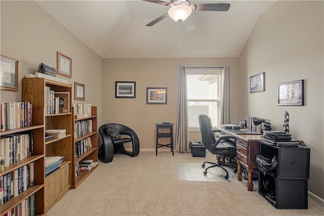 carpeted home office with vaulted ceiling and ceiling fan