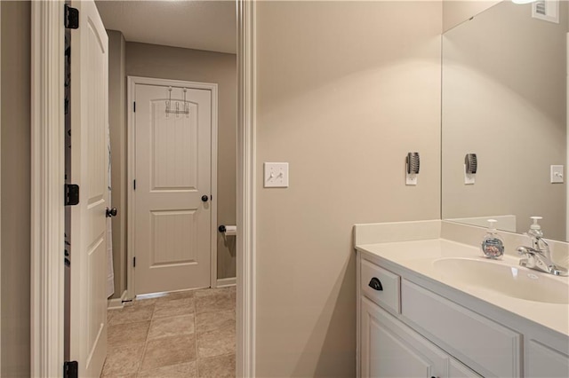 bathroom with tile patterned flooring and vanity