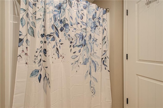 bathroom with a shower with shower curtain