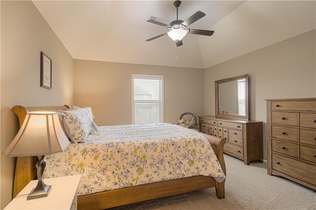 carpeted bedroom with lofted ceiling and ceiling fan