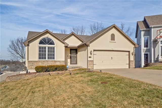 view of front of property with a garage and a front lawn