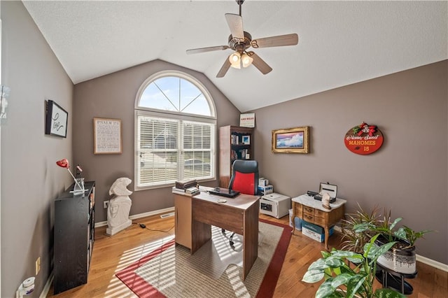 office featuring hardwood / wood-style flooring, ceiling fan, and lofted ceiling