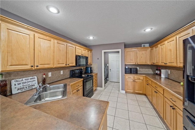 kitchen featuring sink, black appliances, light tile patterned floors, light brown cabinets, and backsplash